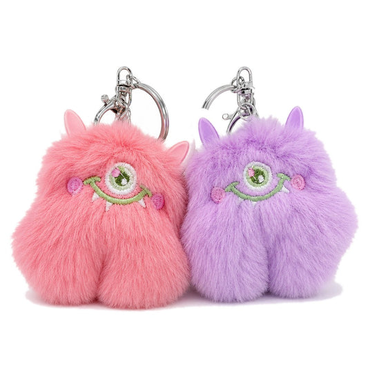 Fuzzy Monster Keyrings — on white